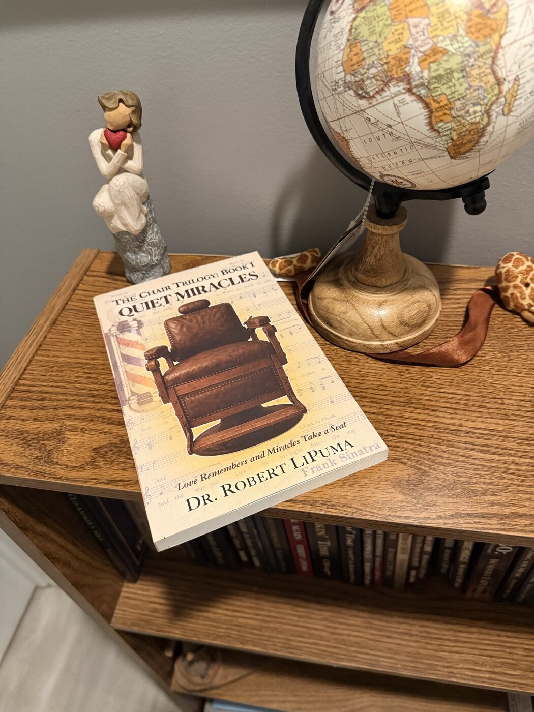 Quiet Miracles on a bookshelf